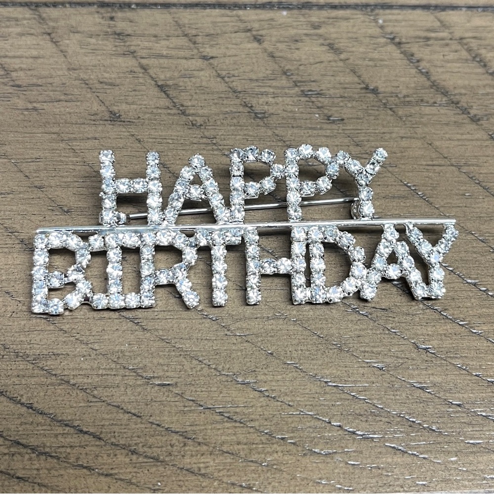 Happy Birthday Brooch NIP, 2.75”x1”, rhinestones form wording, a fun way to show